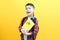 Child boy in glasses isolated on yellow paper wall. Great idea. Happy smiling schoolboy goes back to school