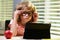 Child boy in glasses using a tablet and study online with video call teacher at home, homeschooling, distant learning E