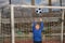 Child boy hold classic football ball in park. Kid hold football ball, banner. Kid with football ball. Sport, soccer