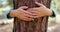 Child boy hugging tree trunk in park, nature life love. Emotional hugging a tree