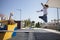 Child boy jumping from Walking the plank of playground pirate ship