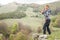 Child boy looking through binocular to the country side