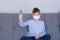 Child boy in medical mask with disinfecting spray looking at camera coronavirus.