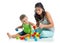 Child boy and mother playing together with block toys