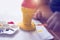 Child boy painting plaster ice cream cone with red and yellow, p