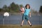 Child boy preparing for basketball shooting. Kid posing with a basketball ball.