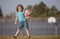 Child boy preparing for basketball shooting. Kid posing with a basketball ball.