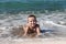 Child boy on sea beach