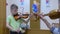 Child boy student plays violin with teacher in music lesson at musical school.