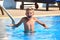 Child boy swimmer. The boy in the pool at the hotel. Sports holiday with children at the resort.