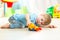 Child boy toddler playing with toy car