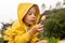 Child, boy, visiting Pravcicka brana in Hrensko, Czech Republic on a rainy summer day