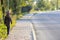 Child boy walking alone on a sidewalk