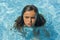 Child breathing while swimming in the pool.