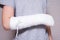 A child broken arm in plaster case, hand injury because of accident, forearm bones fracture