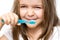 The child brushes teeth, toothpaste