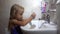 Child Brushing Baby Teeth in Mirror, Kid Washing using Toothbrush, Blonde Young Girl in Bathroom, Children Medical Healthcare