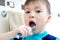 Child brushing teeth, boy dental care, oral hygiene concept, child in bathroom with tooth brush