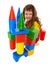 Child built a castle from color cubes