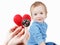 Child and cardiologist, heart symbol in hand, stethoscope.