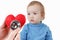 Child and cardiologist, heart symbol in hand, stethoscope.