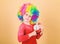 Child care. Happy moments. Kid hold alarm clock. Stop being so serious. Girl cute playful kid wear curly rainbow wig