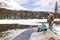 The child caught a fish in a mountain lake. Father ready to help