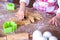 Child Chef preparing the dough. Closeup girl`s chef`s hands with dough and flour, food preparing process