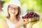 Child with cherries. Little girl with fresh cherries. Portrait of a smiling young girl with bowl full of fresh cherries