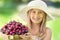 Child with cherries. Little girl with fresh cherries. Portrait of a smiling young girl with bowl full of fresh cherries