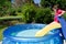 Child in children inflatable pool