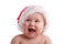 Child in a Christmas cap looking aside 2