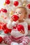 Child with a Christmas present on wooden background. Happy children. Christmas Babies. Christmas children. Cute little