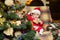 Child with a Christmas present on wooden background. Happy children. Christmas Babies. Cute little child is decorating