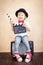 Child with clapper board playing at home