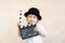 Child with clapper board playing at home