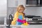 Child cleaning dishware kitchen sink sponge washing dish. Kid housekeeper. Child washing and wiping dishes in kitchen