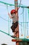 Child climbing in adventure playground