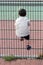 Child climbing fence