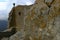 A child climbing on a hight rock wall