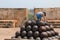 Child climbing on a stack on cannon balls