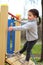 a child is climbing a tightrope in the playground