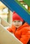 the child climbs the steps on the playground