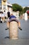 Child clinging to a stone pillar in Vatican City