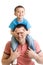 Child closes hands eyes father. Happy little boy enjoying with riding on father`s back. Happy family portrait. Laughing