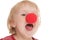 Child with clown nose