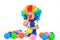 Child clown with a red nose multicolored wig in with balls