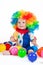 Child clown with a red nose multicolored wig in with balls