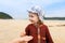 Child collecting shells and on a tropical sandy beach