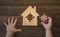 The child collects the house from puzzles on the table.